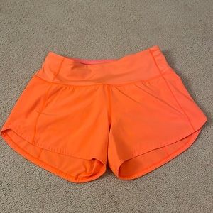 lululemon speed up shorts in Highlight Orange